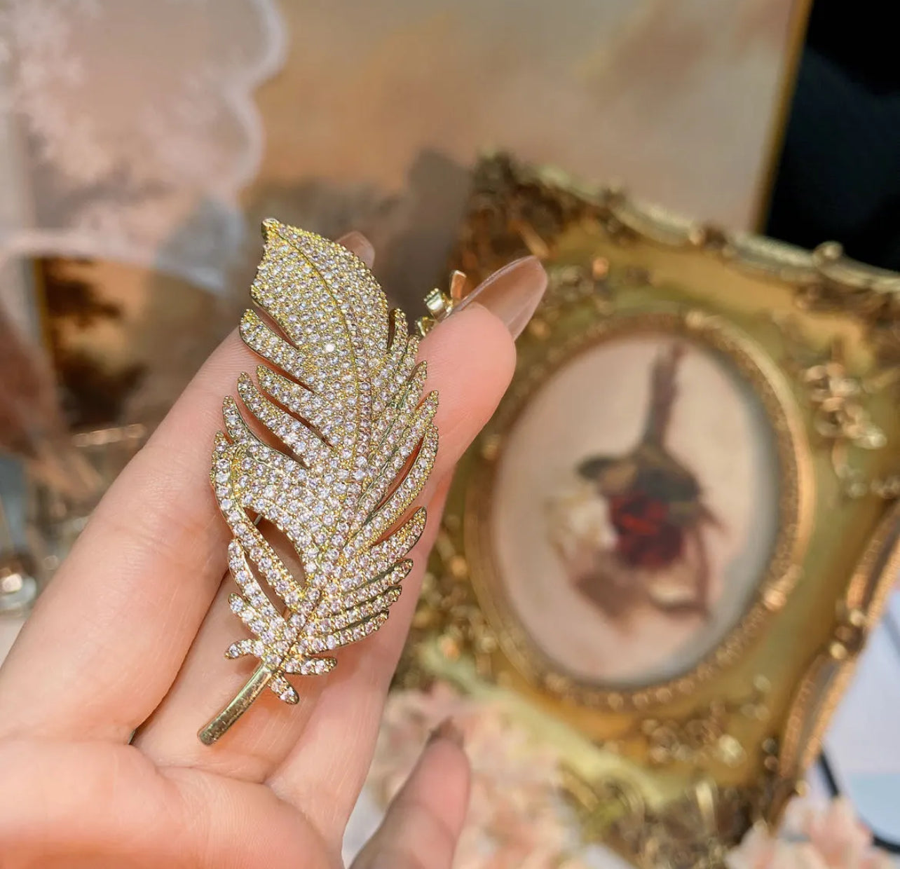 Elegant Gold Feather Brooch