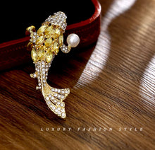 Load image into Gallery viewer, Elegant Gold Fish Brooch with Pearl Accent

