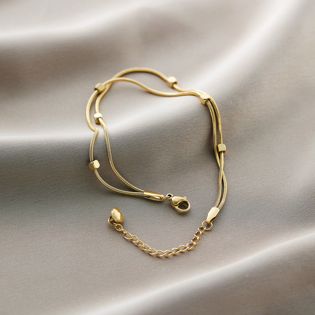 Double strand snake station anklet