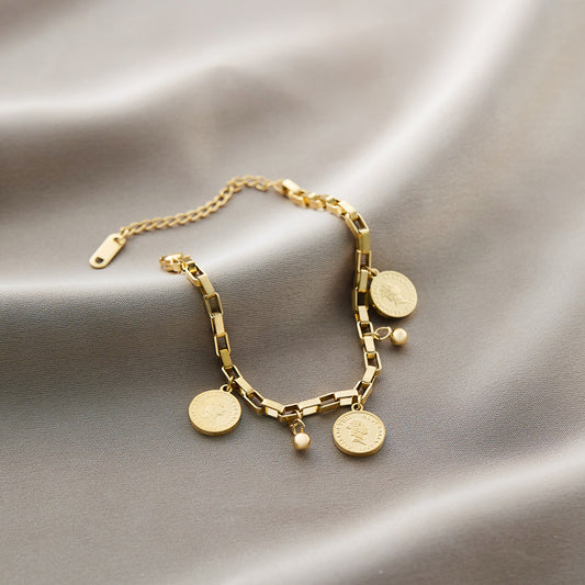 Coin charm bracelet